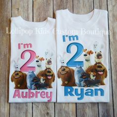 two children's t - shirts with cartoon characters on them