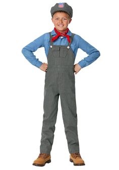 a young boy wearing overalls and a red bandanna standing with his hands on his hips