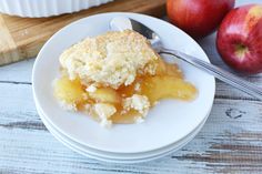 a white plate topped with an apple cobbler