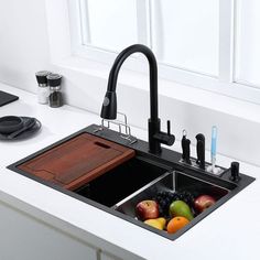 a kitchen sink that has some fruit in it