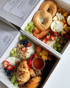 two boxes filled with different types of food