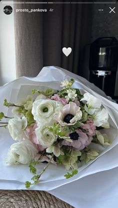 a bouquet of flowers sitting on top of a bed