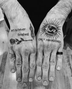 two hands that have tattoos on them with the words, arts never finished only abandoned