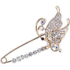 a gold brooch with crystal stones and an angel on the side, sitting on a white background