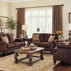 a living room filled with furniture and a large window