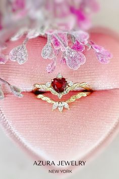 The ultimate symbol of endless love taking a center stage.💫 Our Flaming Heart Red Garnet Ring Set will take your breath away with its romantic heart-shaped red garnet gem and a matching topaz stacking ring to add a spectacular glimmer. Red Heart Ring With Center Stone For Wedding, Elegant Red Promise Stackable Rings, Red Heart Shaped Wedding Rings, Red Diamond Heart Ring For Wedding, Heart Shaped Red Ruby Ring For Wedding, Heart-shaped Red Ruby Wedding Ring, Wedding Red Diamond Heart Ring, Red Marquise Birthstone Ring For Gift, Red Marquise Cut Birthstone Ring Gift