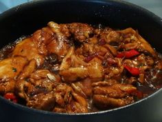 a close up of food in a pan on a stove