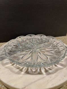 a glass plate sitting on top of a marble counter