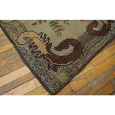 an animal rug on the floor with wood floors