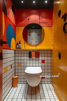 a bathroom with orange, yellow and red walls