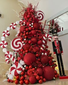 a christmas tree decorated with candy canes and ornaments