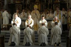 the priests are sitting in front of the alter