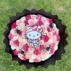 a hello kitty bouquet with roses in it