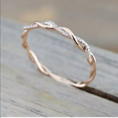 a wedding band that has been made to look like a wave with diamonds on it