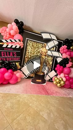 an oscars party with balloons and decorations