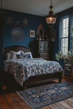 a bedroom with blue walls and wooden floors