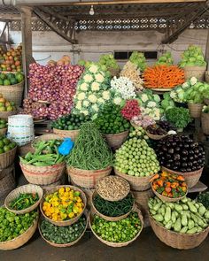 many baskets filled with different types of fruits and vegetables