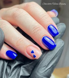 Gorgeous stand out blue with heart accents Blue Nails With A Heart, Sweethearts Nails, Simple Blue Heart Nails, Blue Nails Heart Design, Royal Blue Nails With Hearts, Bright Blue Nails With Design