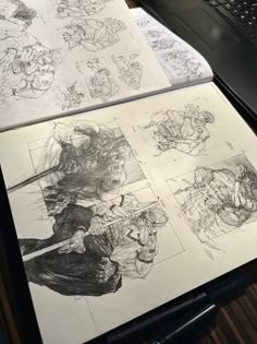 some drawings are sitting on top of a table