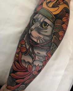 a cat with a crown on it's head is shown in this tattoo design