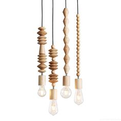 three light bulbs hanging from the ceiling with wooden dows and strings attached to them