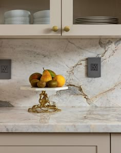 a marble counter top with some fruit on it