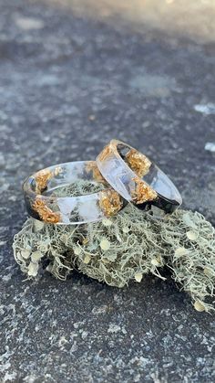 This is a handcrafted gold flake resin ring. This gold flake ring was created with clear epoxy resin. I have added white and black ink dye colorants. Gold flakes were added.  This ring is in my flat style. This ring would be perfect for a couple ring set or as a promise ring. -This ring can be purchased as a single ring or as a couples set! Discount is included for the set!! -Ring Sizing- Rings are 6mm wide Ring sizes are 4US-12US -Process- All my rings are handcrafted. Epoxy resin is added to silicone molds. Once the resin is set, they are demolded. I hand sand the edges. A top layer of resin is added on the ends for a beautiful shine and smooth edges. *The item on the photos is only a sample and you will receive a similar item with the same good quality! *Due to different monitors the co Gold Resin Rings As A Gift, Gold Resin Rings For Gifts, Gold Resin Rings Suitable As A Gift, Gold Resin Rings For Gift, Gold Resin Rings Perfect For Gifts, Gold Promise Rings With Natural Inclusions, Gold Resin Nature-inspired Jewelry, Nature-inspired Gold Resin Jewelry, Handmade Clear Wedding Rings