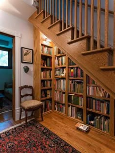 the stairs are made of wood and have bookshelves