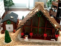 a gingerbread house is decorated with christmas decorations