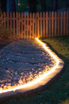 a garden path with lights on it and the words perfect patio lighting landscaping for your family