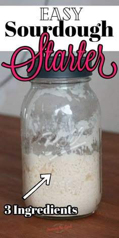 a mason jar filled with sourdough starter ingredients