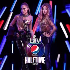 two women standing next to each other in front of neon colored lights with the pepsi logo