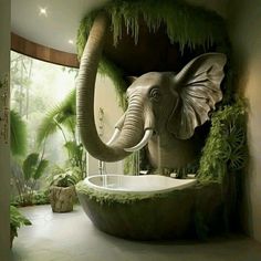 an elephant statue in the middle of a bathroom with plants on the walls and floor