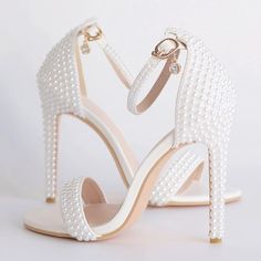 Category:Wedding Shoes; Embellishment:Pearl; Season:Summer; Heel Type:Stiletto Heel; Gender:Women's; Toe Shape:Open Toe; Type:Bridal Shoes,Wedding Sandals; Style:Elegant,Classic; Heel Height(inch):4-5; Outsole Materials:Rubber; Occasion:Wedding,Party; Closure Type:Ankle Strap; Pattern:Solid Colored; Shipping Weight:0.55; Production mode:Self-produce; 2022 Trends:Ankle Strap Sandals; Foot Length:; Size chart date source:Provided by Supplier. Strappy Wedding Shoes, Bride Heels, Wedding Shoes Pumps, Elegant Wedding Shoes, Wedding Pumps, Bridal Heels, Strappy High Heels, Wedding Shoes Heels, Bling Shoes