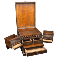 an old wooden box with several drawers