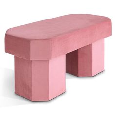 a pink bench sitting on top of a white floor