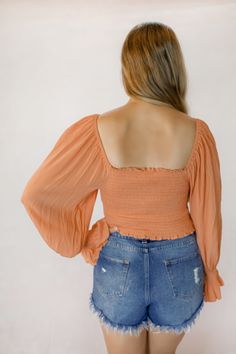 This orange crop top features a ruched smocked body and drawstring bust. It can be worn on or off the shoulder. The model is wearing a size medium. Orange Crop Top, On Or Off, Shop Tops, Boring Clothes, The Model, Cute Woman, Fashion Inspiration, Clothes For Sale, Spring Fashion