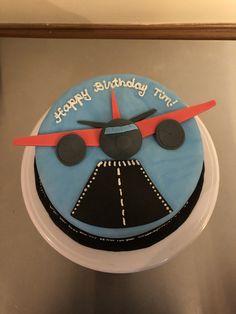 a birthday cake with an airplane on it