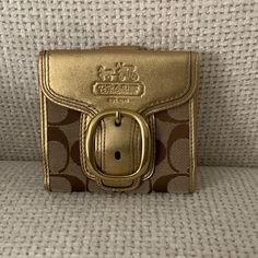 Brand New With Tags Coach Gold Buckle Wallet. In Perfect Condition. Offers Welcome! Classic Gold Bifold Bag, Gold Rectangular Coach Coin Purse, Elegant Gold Coach Coin Purse, Designer Gold Bifold Wallet, Coach Gold Wallet For Everyday Use, Coach Gold Wallets For Everyday Use, Designer Brown Coach Wallet, Gold Coach Wallet, Gold Bifold Coin Purse For Everyday Use