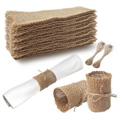 burlap and jute bags with twine wrapped around them, on white background