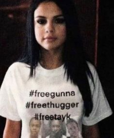 a woman wearing a t - shirt that says freegunna