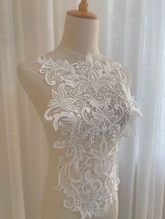 Color: Off White, Black Usage: lace wedding dress applique , bridal headdress,lace collar, lace patch ,Decorative wedding shoes Ideal for Dress, headbware, female underware brim,handbag accessory, hat. pillow,curtain,dolls outfits , home decor etc. My store links： https://www.etsy.com/shop/FionaLace?ref=simple-shop-header-name&listing_id=919538968 Similar product links: https://www.etsy.com/shop/FionaLace?ref=simple-shop-header-name&listing_id=919538968&section_id=32034550 Lace trim Elegant White Lace Bodice, Elegant Fitted Lace With Appliques, Embroidered Fitted Lace Top For Wedding, White Lace Patchwork Top For Wedding, Lace Top With Lace Work For Wedding, Embroidered Lace Top For Wedding, White Lace Trim Bodice For Wedding, Wedding Bodice With Lace Trim, White Lace Top With Lace Patchwork For Wedding