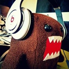 a stuffed animal with headphones on it's ears