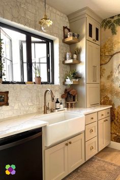 a kitchen with a sink, dishwasher and wallpaper on the walls in it