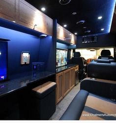 the interior of a vehicle with an aquarium in the center and seats on both sides