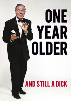 a man in a tuxedo is standing with his hands together and the words one year older are written on it