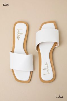 Summer's coming, so get a fresh pedi and grab the Lulus Brenner White Flat Square-Toe Slide Sandals! These smooth vegan leather sandals have a wide toe band, a tapered square toe, and an easy slide-on design. 0. 25" rubber heel. Cushioned insole. Rubber sole has nonskid markings. Man made materials. Imported. Lulus | Brenner White Flat Square-Toe Slide Sandal Heels | Vegan Friendly. White Sandals Flat, Tapered Square, White Flat, Sandal Heels, White Slip, White Sandals, White Flats, Rubber Heels, Vegan Friendly