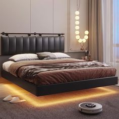 a bed with lights on the sides and a rug underneath it in front of a window