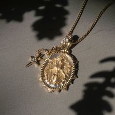 This intricate depiction features Lilith’s open wings as she reigns under the black moon, empowering you to reclaim your rights, burn all that does not serve you, and set you free to explore the dark side. This Special Edition Lilith Necklace is cast in 14k gold vermeil and sits on a slice of mother of pearl that shines through to add a shadowy reflection against her form. Her fluted spikes adorn a coin edge and spiked prongs hold her in place. Rising From The Ashes, Open Wings, The Garden Of Eden, Burning Desire, Goddess Jewelry, Halo Necklace, Black Moon, Charm Necklace Silver, Garden Of Eden