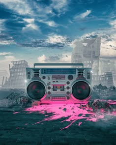 a boombox with pink paint on the ground in front of a cityscape